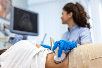 Doctor conducts ultrasound examination of patientv kidneys. Internal organs ultrasound concept....