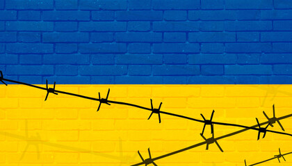 Ukrainian flag on the background of military attributes.