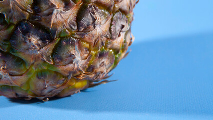 Pineapple on a blue background. close-up view