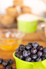 making blueberry muffens in a kitchen