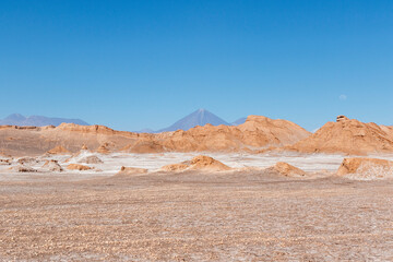 Valle de la Luna in Atacama desert withe Licancabour volcano in the background, Antofagasta, Chile, South America