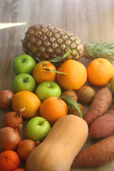 Various healthy fruit and vegetable on wooden background. Selective focus.
