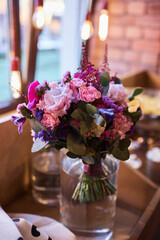 Beautiful and bright wedding bouquet in a vase