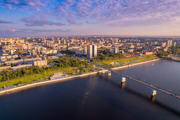 Obraz premium Aerial top view panorama city Perm and central embankment of Kama river Russia, sunset drone photo