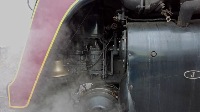 A Close Up Look at the Compressor and Valves of an Antique Steam Locomotive as it Gets Ready for a Day Work