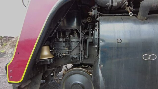 A Close Up Look at the Compressor and Valves of an Antique Steam Locomotive as it Gets Ready for a Day Work