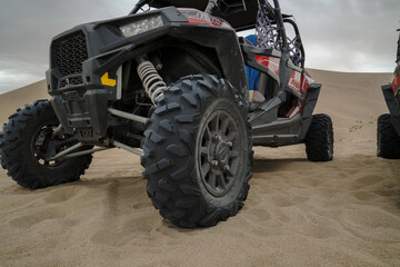 Atv in desert, closeup view on wheel. © Leo Li