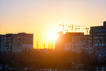 Beautiful sunset over high-rise buildings in the city.
