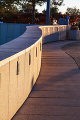 Winding stone path with a curb in the park.