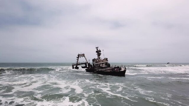 Sunken trawler, shipwreck. Old rusty metal ship Zeila at Skeleton Coast Namibia.