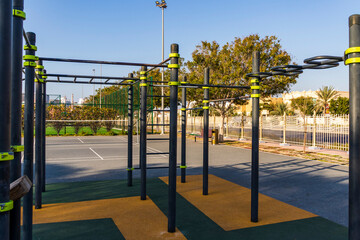 Fototapeta na wymiar Outdoor gym, pull up bars in the park. Sports