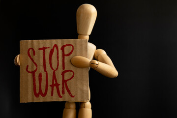 STOP WAR written on red, holding on black background