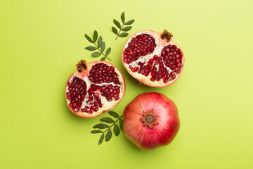 Fresh juicy pomegranate on color background, top view