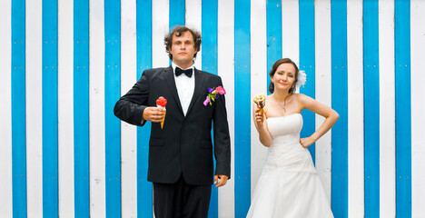 A great bridal couple with sweet, colorful ice cream take a break to cool down. Creative wedding...