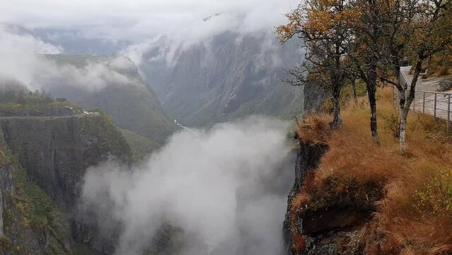 View along the impressive Valley of Voringfoss Waterfall in Noway. Steep depths