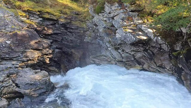 rushing water of a mountain rive  in a gorge of rugged rocks