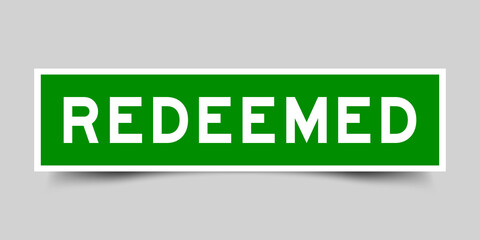 Square label banner with word redeemed in green color on gray background