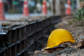 Hard HatSafety Worker's yellow lay on the ground at a construction site after workers removed it...