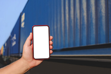 Close-up, smartphone mockup in male hand. Against the background of a railway carriage.