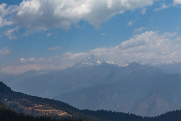 Naklejka na ściany i meble View at the snow capped Himalaya mountains in Central Bhutan, Asia