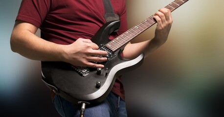 Guitarist male hands playing the guitar. Classical concert, performance, show.