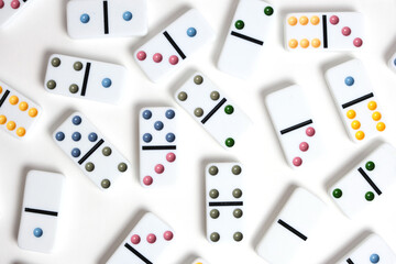 Fototapeta na wymiar Dominoes with colorful coloring on a white background.