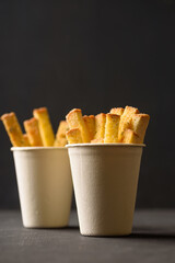Garlic roasted bread stick on black background, a popular Asian snack food