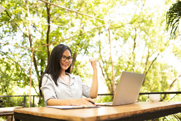 Businesswoman working use laptop in office for discussing documents and ideas , with soft focus, vintage tone