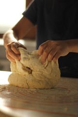 female hands knead the dough