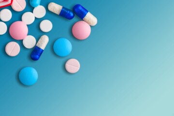Antibiotic capsule pills on background. Prescription drugs. Colorful capsule pills.