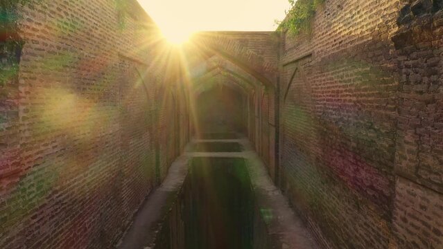 Aerial view of an ancient fort with sunshine over the walls