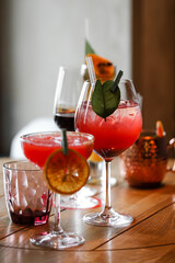 Coctails red with berries and ice in the bar