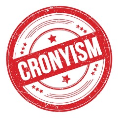 CRONYISM text on red round grungy stamp.