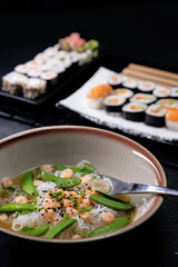 Various dishes of Asian cuisine with typical sushi