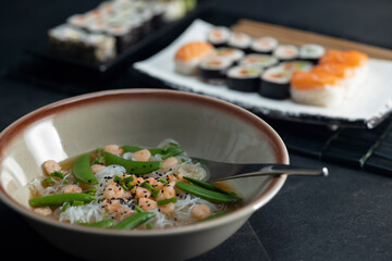 Various dishes of Asian cuisine with typical sushi