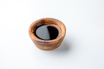 wooden gravy boat with soy sauce isolated on white background