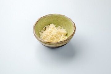 ceramic gravy boat with grated cheese