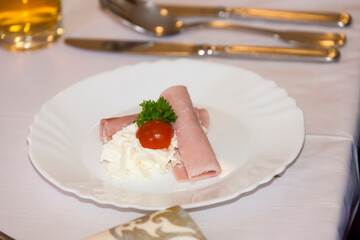 ham roll filled with horseradich spread as a starter  on wedding table