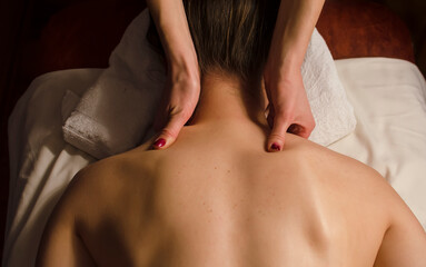 Fototapeta premium Young woman relaxes on thai massage, close up