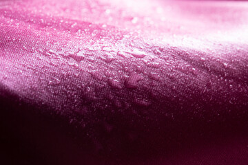 Water drops on pink waterproof fabric,Waterproof coating background