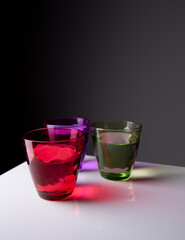 Multicolored glass over a black background.vintage glassware