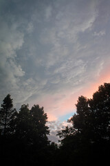 Fototapeta na wymiar Storm clouds rol in at sunset