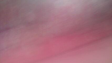 Abstract blur background with gray-brown, black, white, red and earth tones.