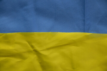 Yellow-blue national flag of Ukraine as a background, stop war and peace in Ukraine 2022