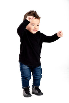 Beautiful 2 Year Old Baby Dancing And Smiling, White Background, Isolated, Hispanic Boy, Brown Eyes