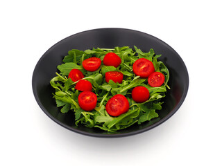 Green Arugula salad with red tomatoes isolated on white background