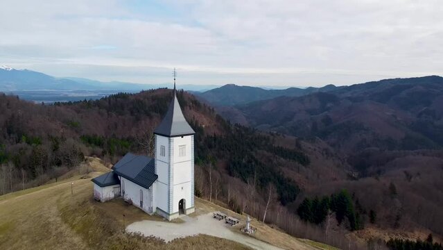 Aerial drone view of landscape of church of St. Primoz Slovenia Jamnik