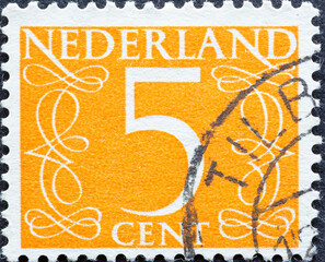 Netherlands - circa 1953 : a postage stamp from the Netherlands , showing a numeral framed with...