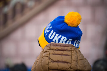 Portrait on back view of man wearing an ukrainian woolen hat