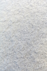 Clean, white snow close-up. Winter background. Snow surface. Fresh fluffy white snow texture.White snowflakes.